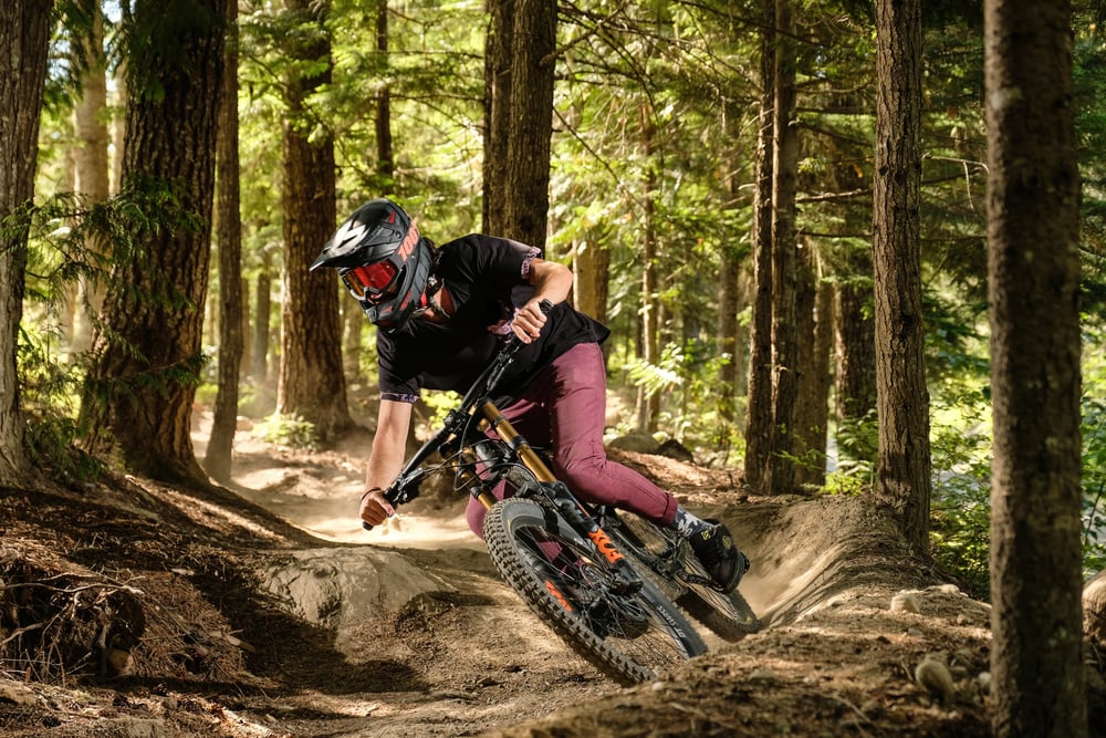 Man Mountain Biking in Forest